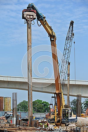 Retaining wall steel sheet pile installation by machine Editorial Stock Photo